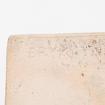 Rut Bryk, plates, as well as plate/wall relief, stoneware.