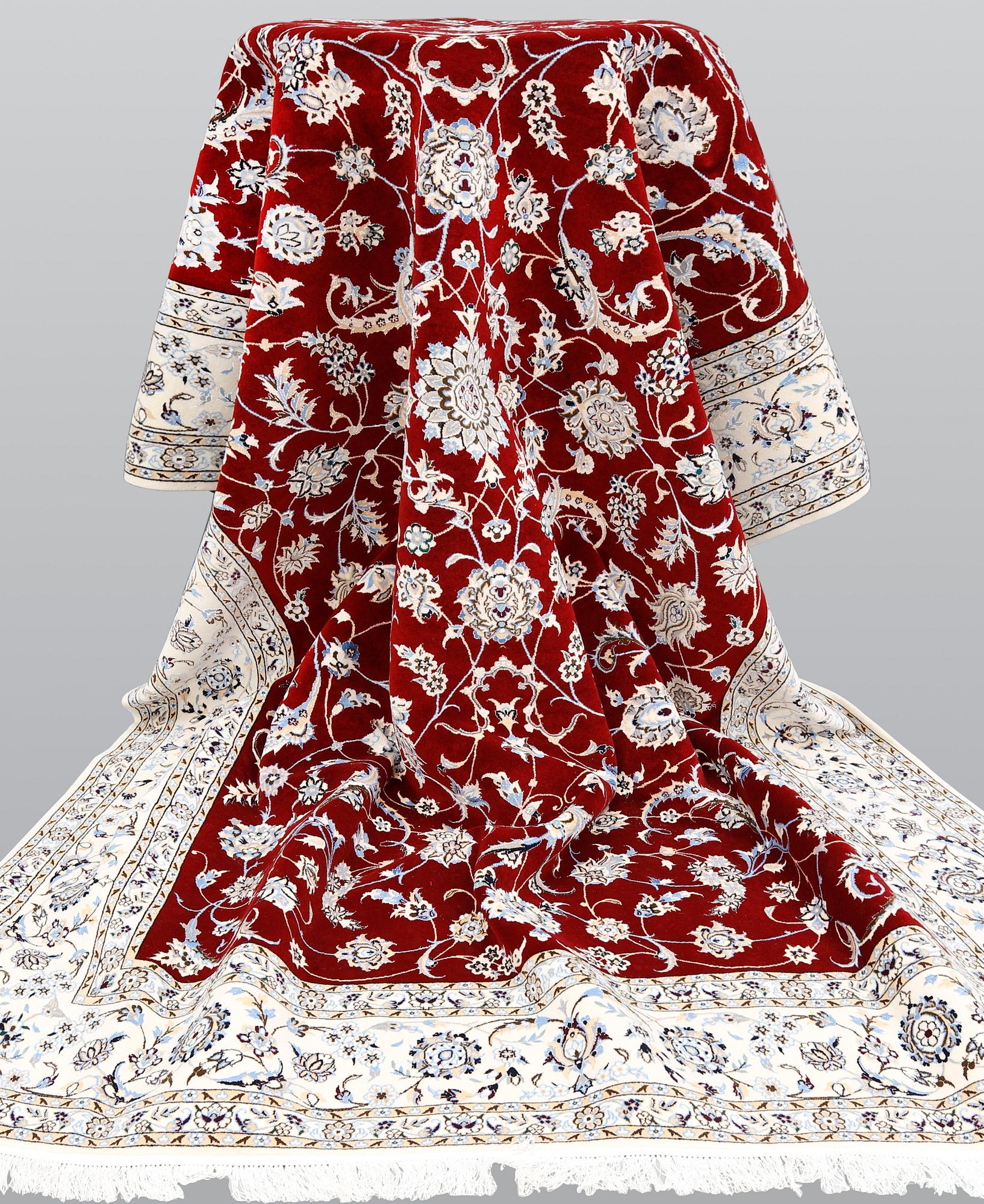 A Nain part silk carpet, 302 x 204 cm.