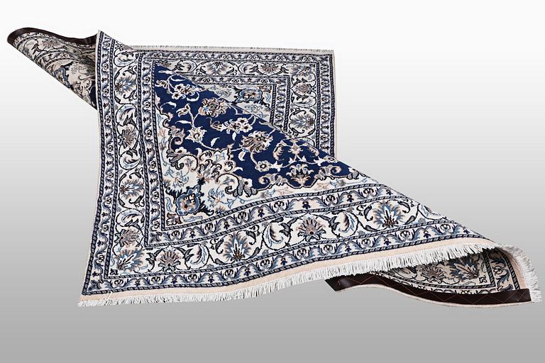 A carpet, Nain, part silk, ca 202 x 148 cm.