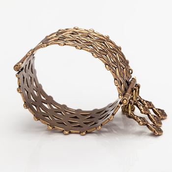 A bronze bracelet "Volga Finns bracelet". Kalevala Koru, Helsinki.