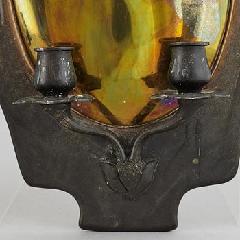 A pair of bronze and brass wall sconces from the early 20th century.