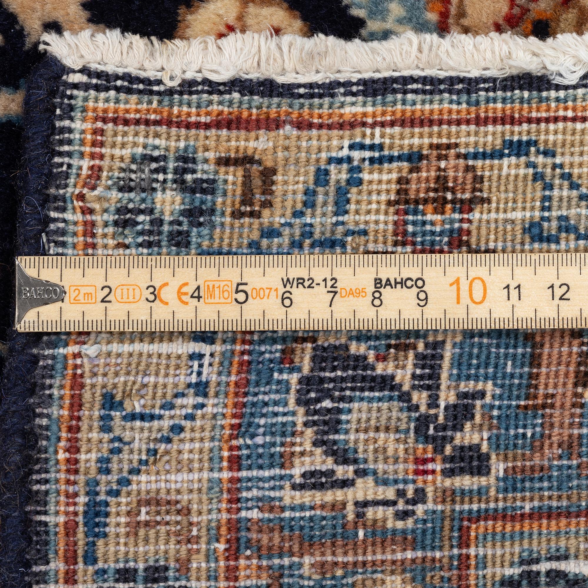 A Keshan rug, approx. 370 x 297 cm.