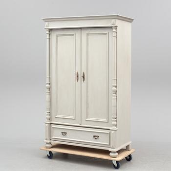 A wardrobe, circa 1900.