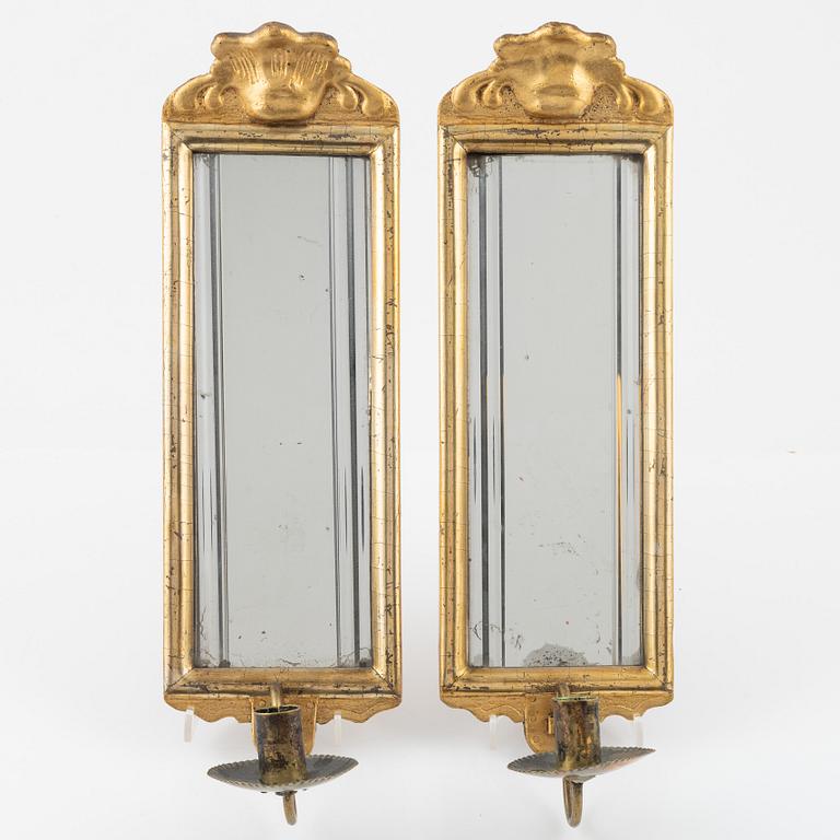 A pair of Rococo-style giltwood one-light mirrored wall sconces, 19th Century.