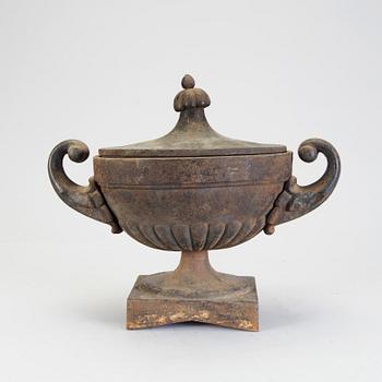 A 20th century cast iron urn.