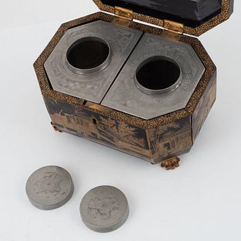 A lacquer box with pewter tea caddies, China, Qingdynasty, 19th century.