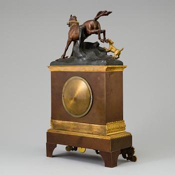 a late empire mantel clock from the first half of the 19th century.