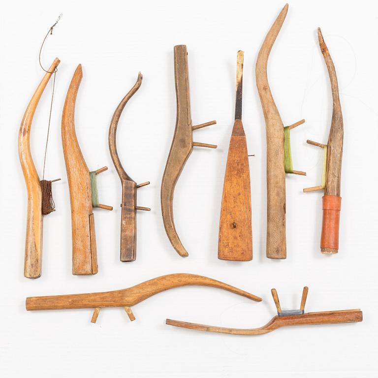 NINE WOODEN ICE FISHING RODS, ca 1900.