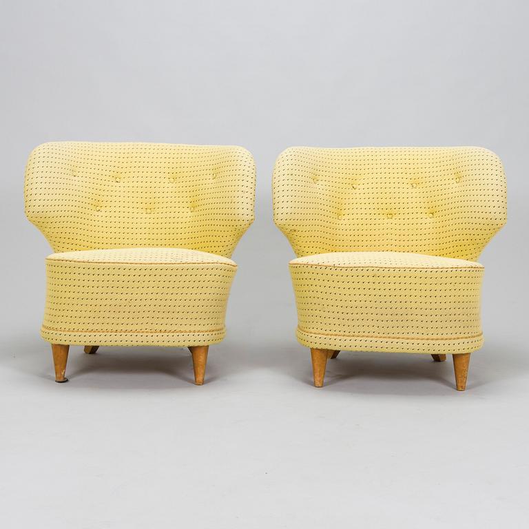 A pair of mid-20th-century armchairs.