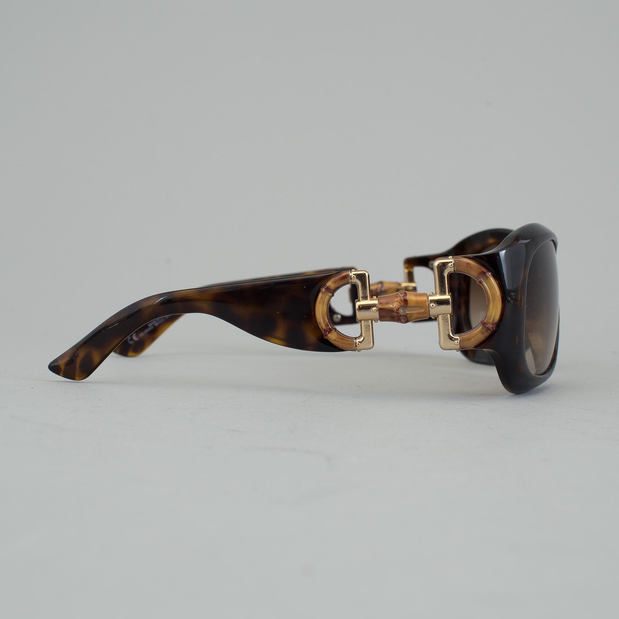 A pair of Gucci GG2970/S sunglasses with case.