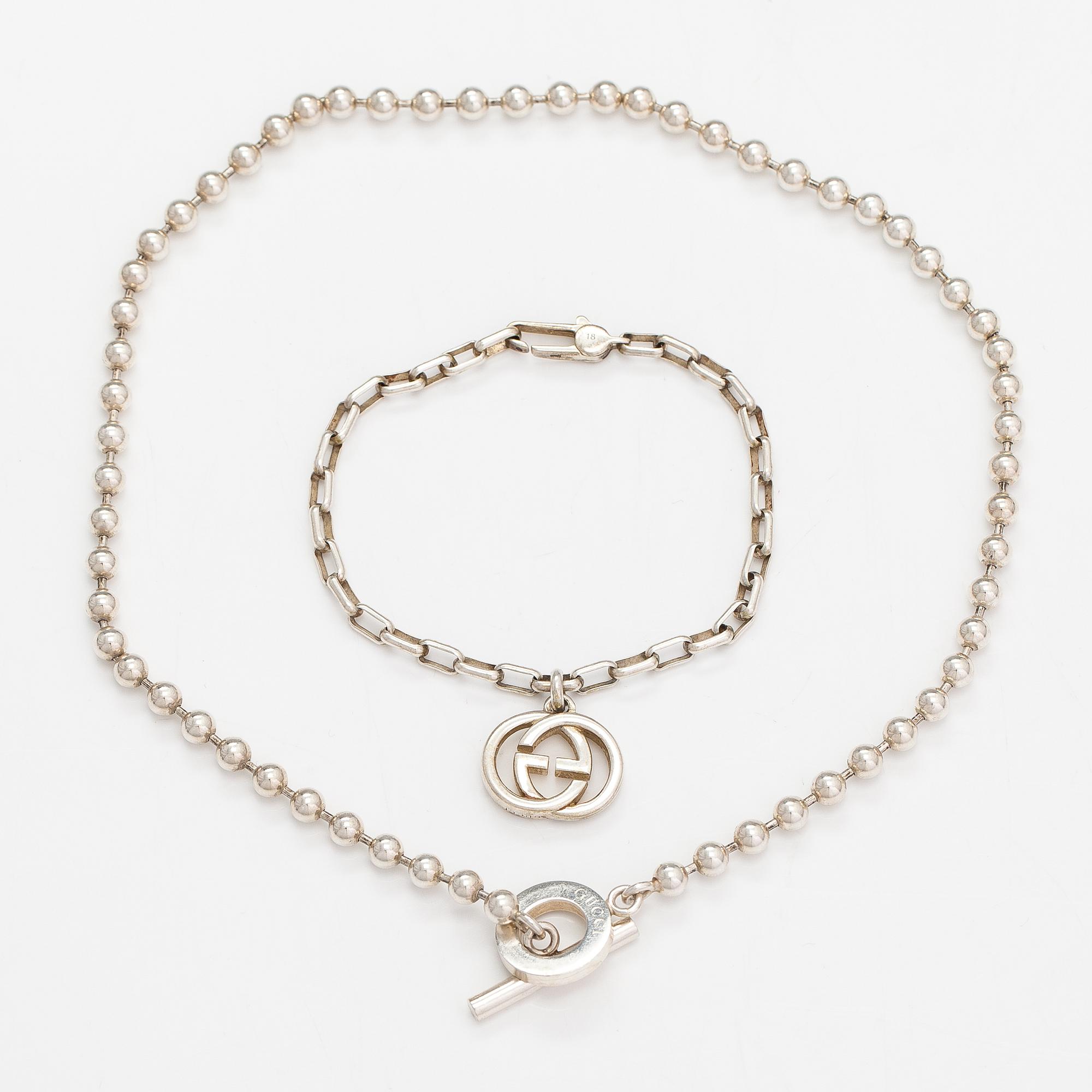 Gucci, A pair of earrings, bracelet, ring and necklace made of sterling silver. Marked Gucci, Made in Italy.