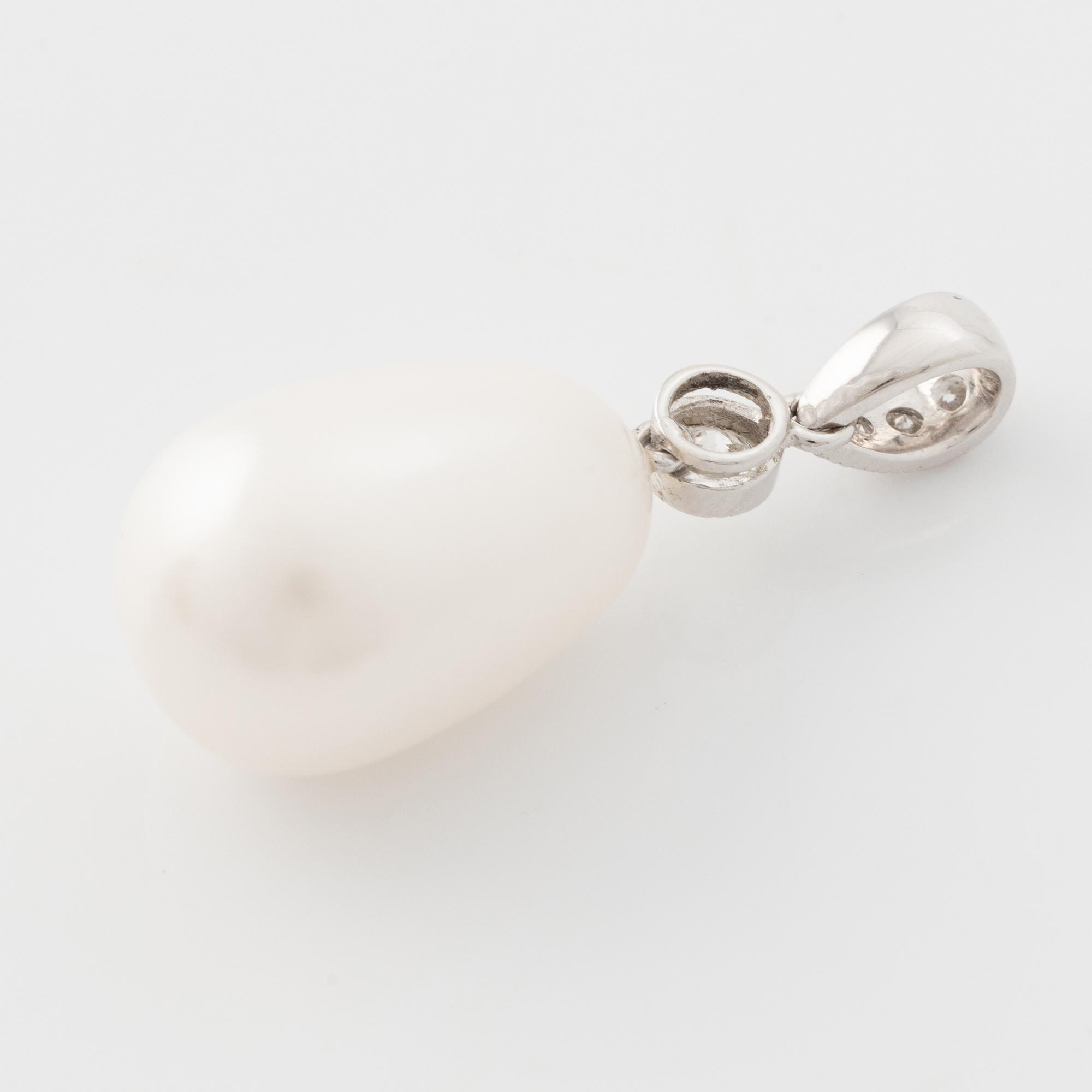 White gold pear shaped cultured pearl and brilliant cut diamond pendant.