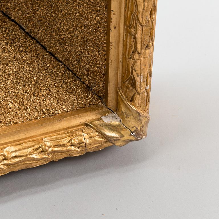 A gilt and bronzed frame from the beginning of the 20th century.