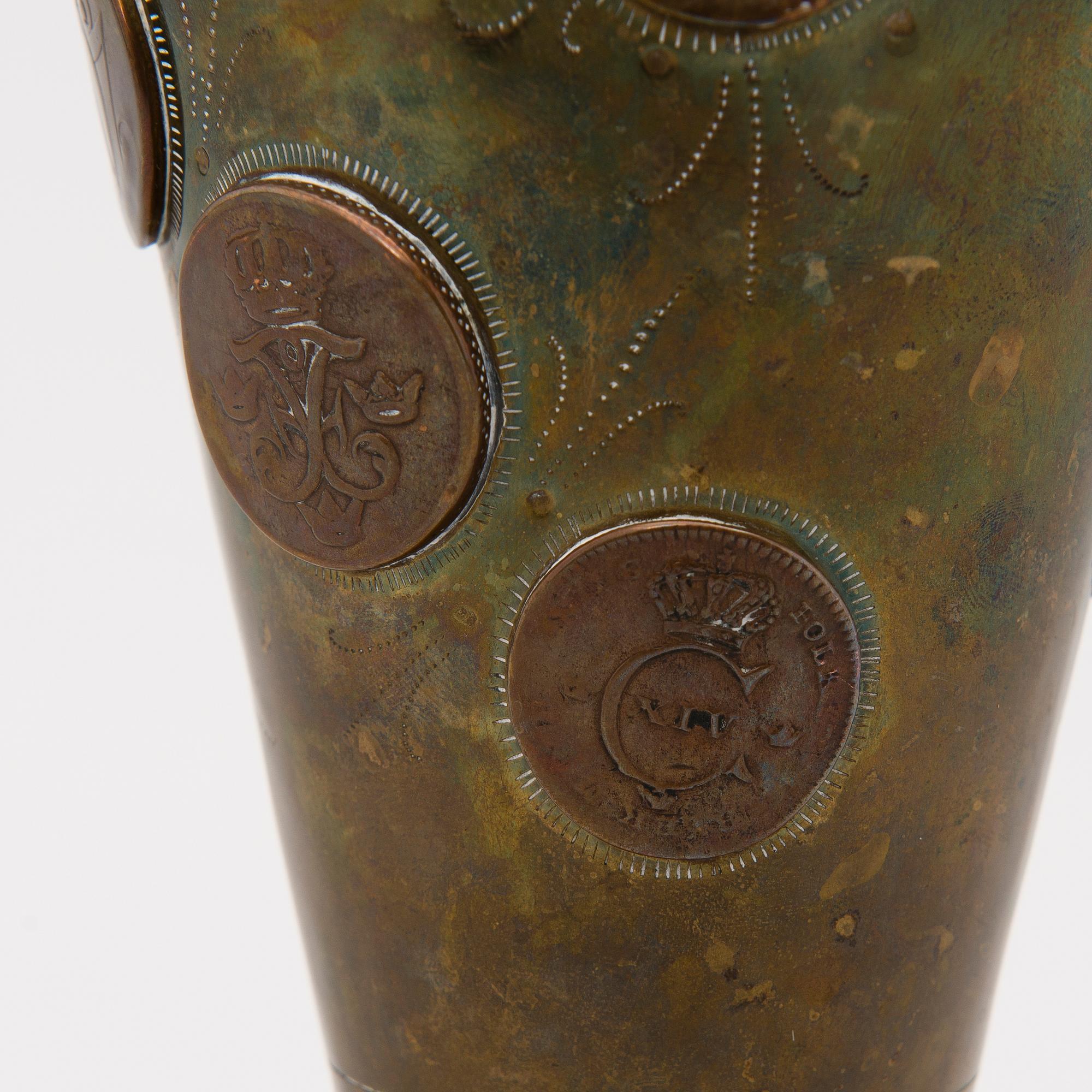 A late 19th Century brass cup.