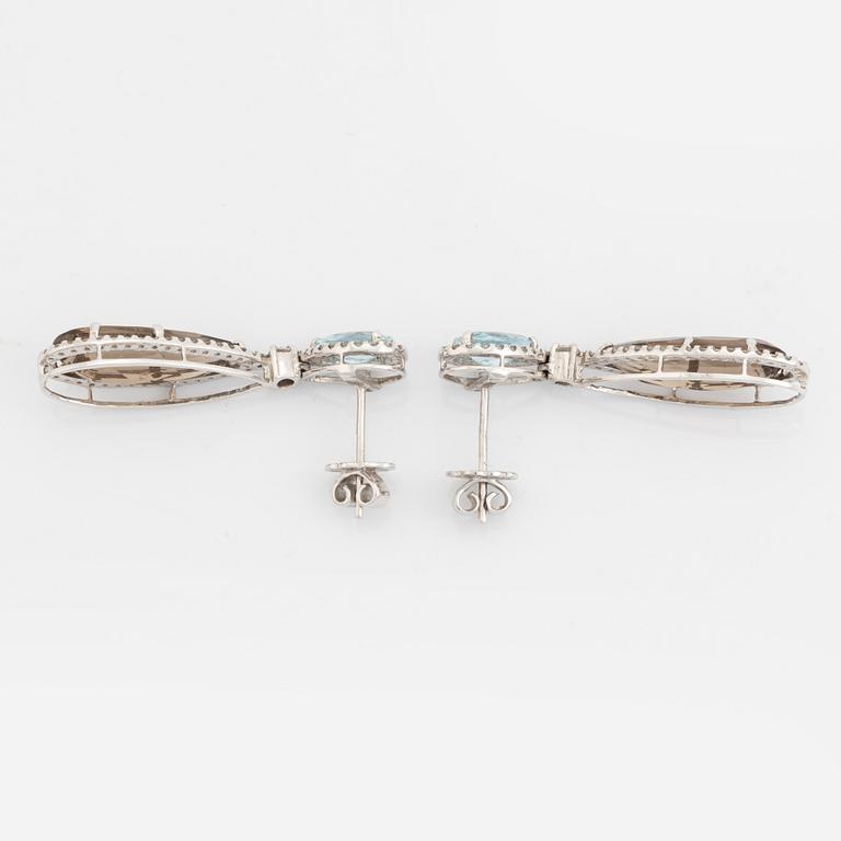 Aquamarine and smoky quartz and brilliant cut diamond earrings.