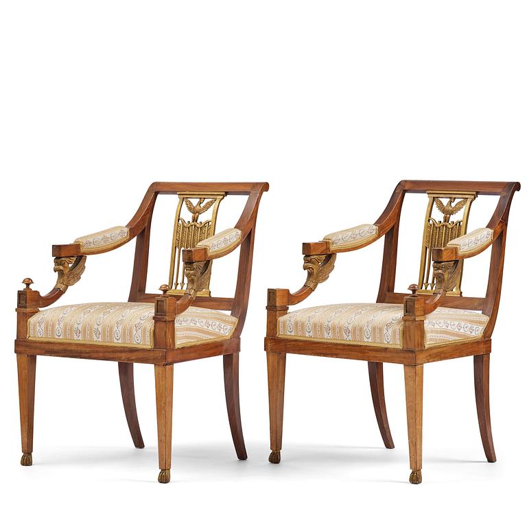 A pair of presumably Baltic empire mahogny armchairs.