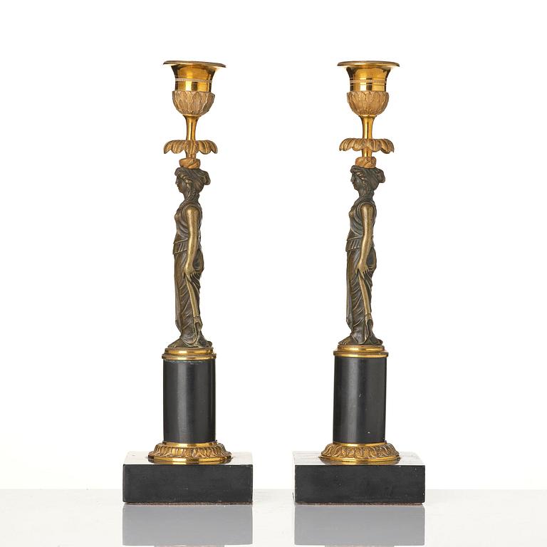 A pair of late Gustavian marble and ormolu candlesticks in the manner of F. L. Rung (1758-1837).