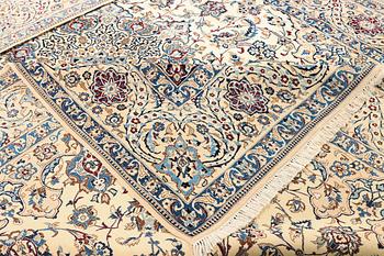 A Nain, part silk carpet, c. 474 x 322 cm.