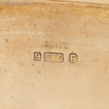 A Cartier 9 carat gold and calibré-cut sapphires cigarette case, London.