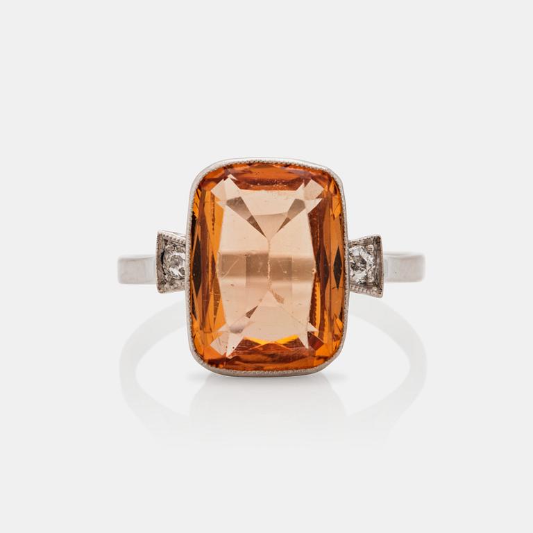 A circa 3.30 ct topaz and old-cut diamond ring. Total carat weight of diamonds circa 0.10 ct.