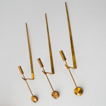 PIERRE FORSSELL,  three 'Pendeln' brass wall sconces from Skultuna.