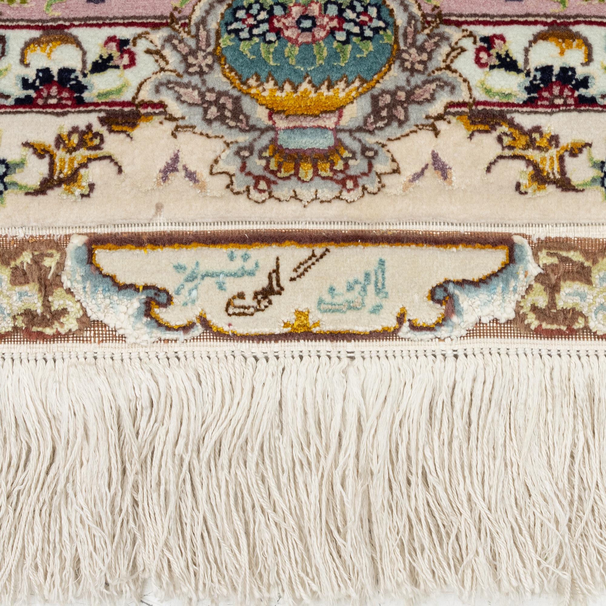 A Tabriz rug, signed, c. 160 x 101 cm.