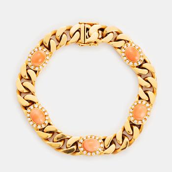 383. A Bucherer bracelet in 18K gold set with coral and round brilliant-cut diamonds.