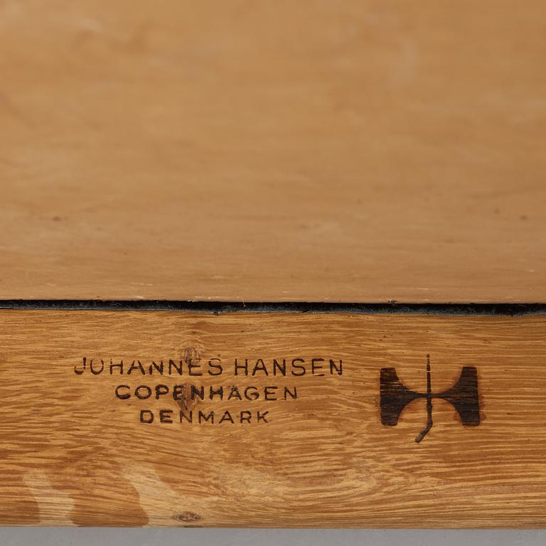 A pair of Hans J Wegner's oak 'The Chair' by Johannes Hansen, Copenhagen.