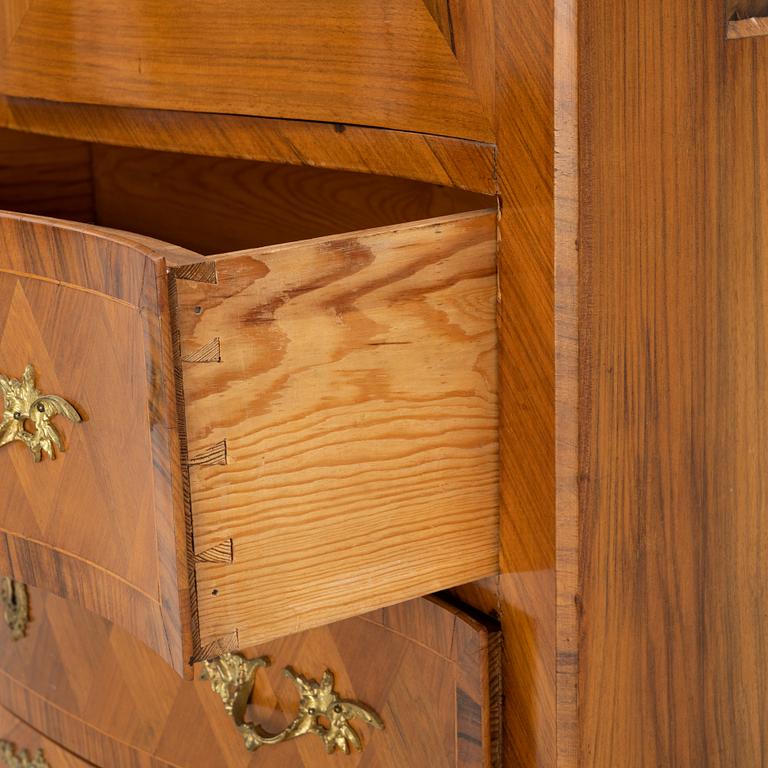 A walnut veneered Louis XV style cabinet, early 20th Century.