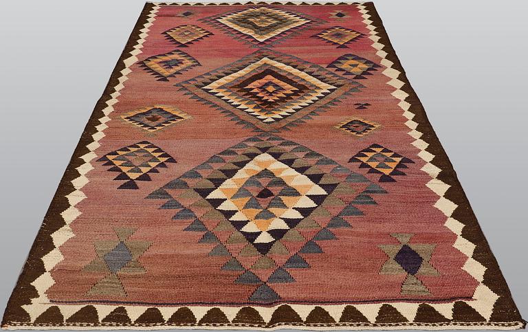 A Persian Nomad kilim carpet, ca 258 x 150 cm.