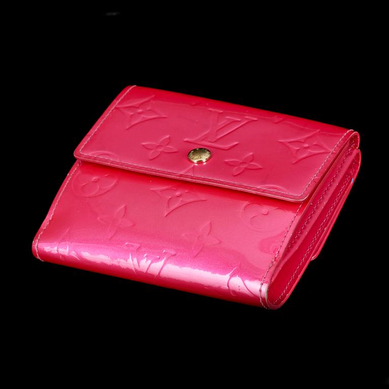 A cerise monogram vernis wallet by Louis Vuitton.