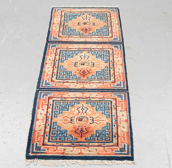 A semi antique chinese meditation rug, ca 159,5 x 57 cm.