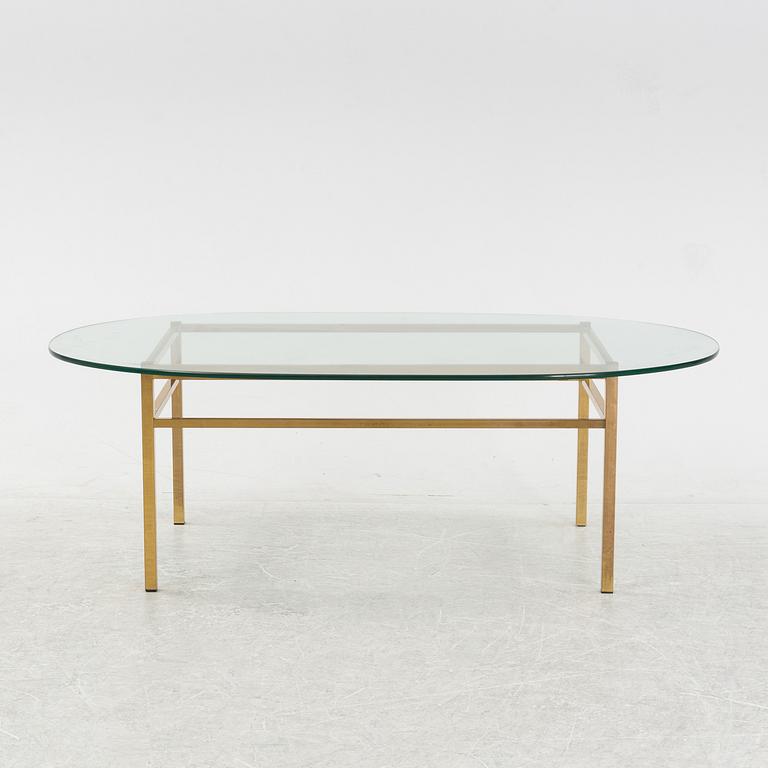 A glass and brass coffee table, Engelsson, Sweden, 21st century.