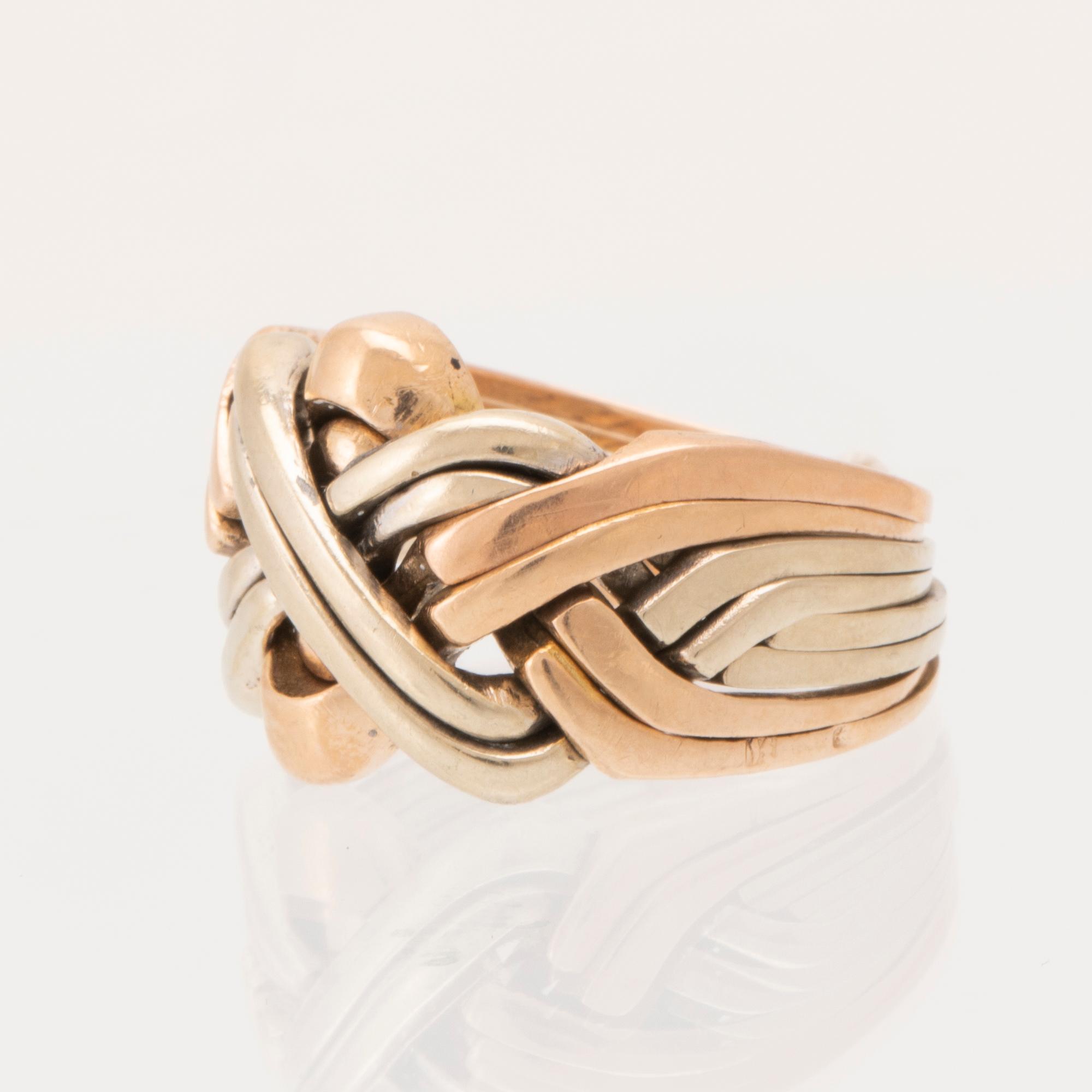 Ring "Pusselring" 14K rosé, vitt och rött guld.