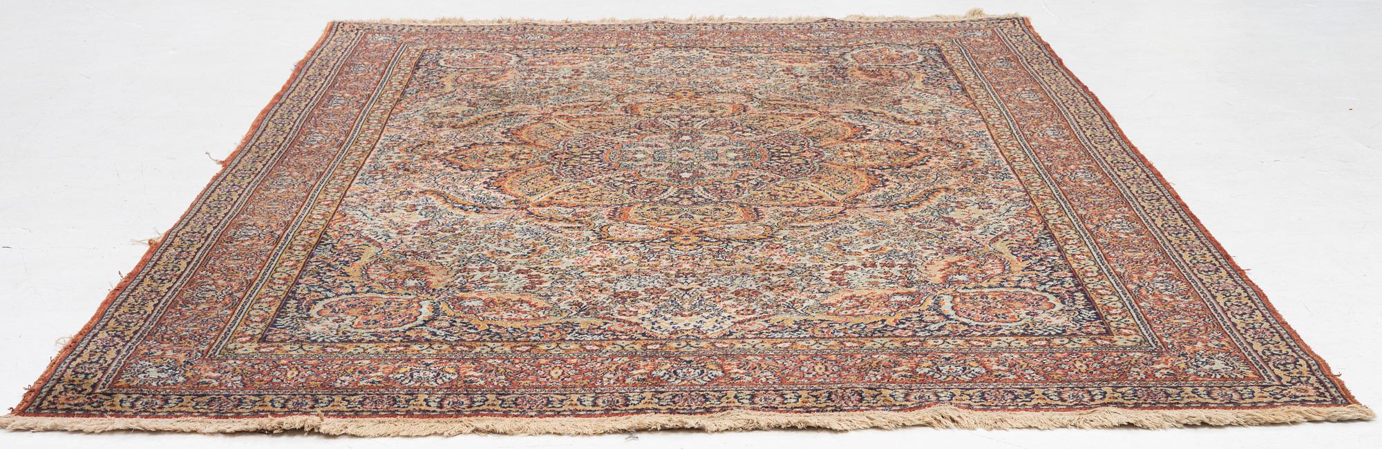 A semi-antique oriental carpet, c. 290 x 195 cm.