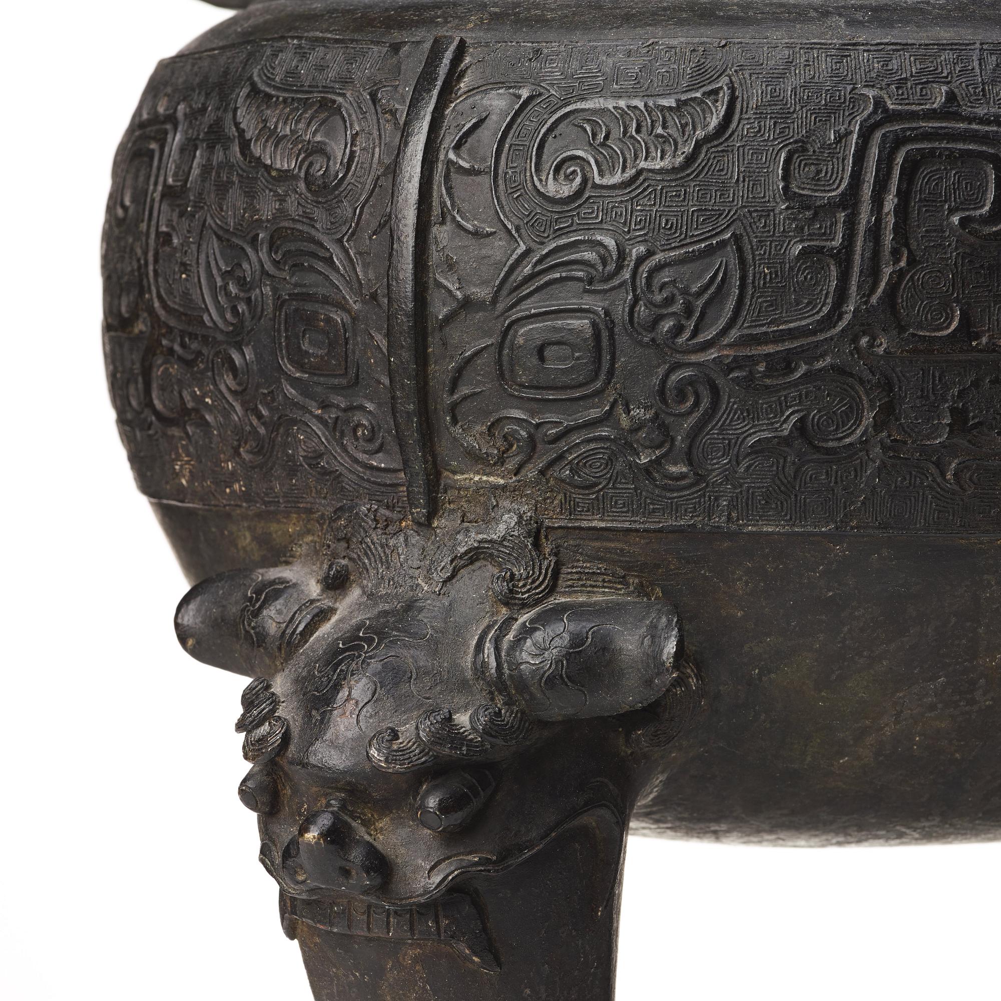 A large bronze censer with cover, presumably late Ming dynasty (1368-1644).