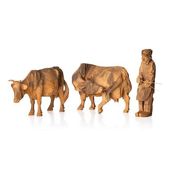 634. Axel Petersson Döderhultarn, Two cows and a man with prod.