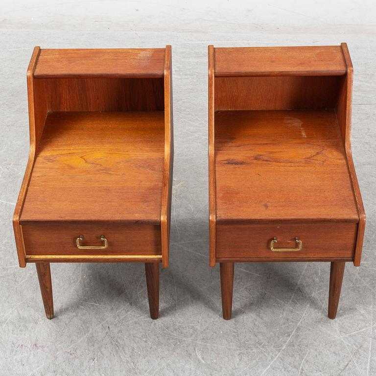 A pair of teak veneered bedside tables.