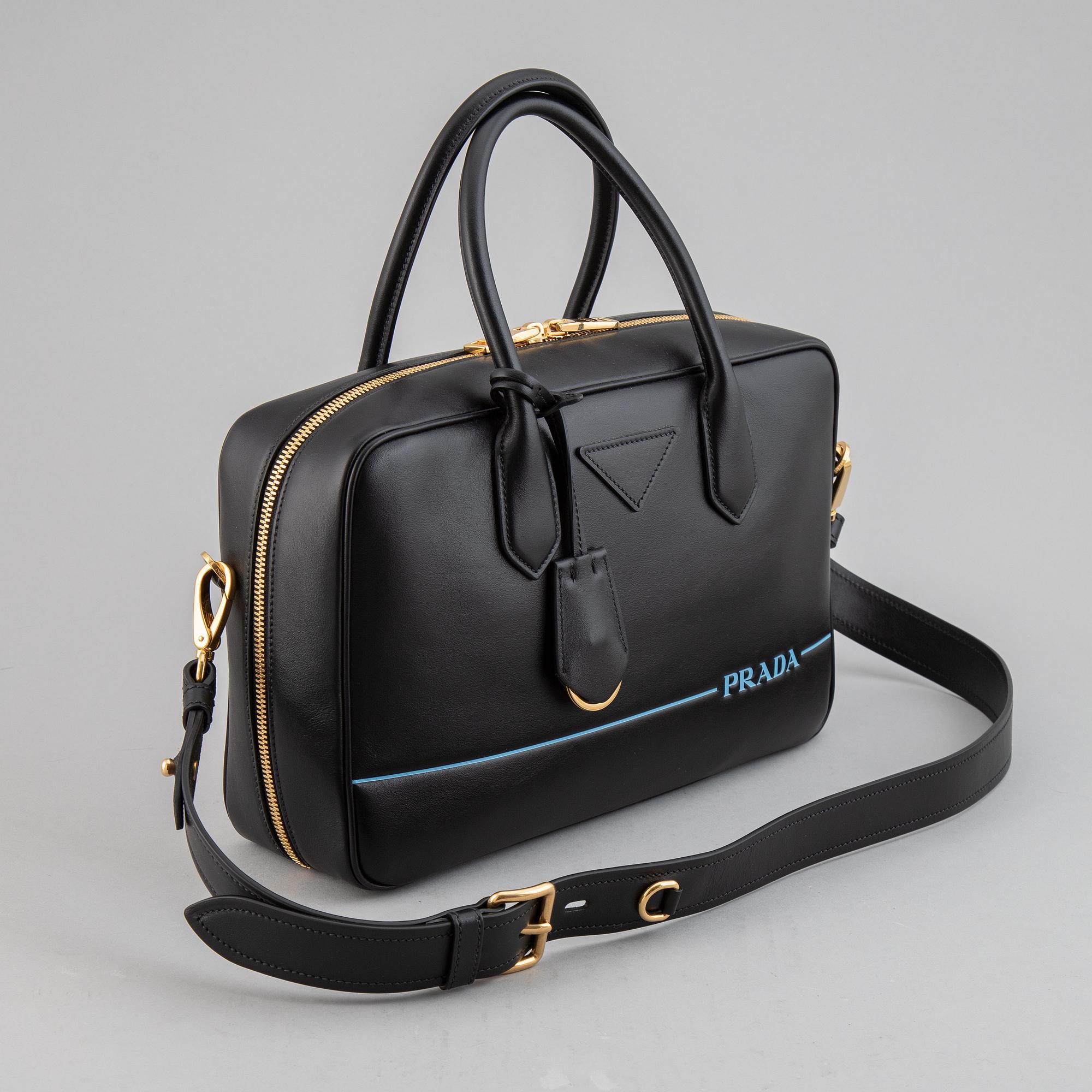 PRADA, a leather bag.