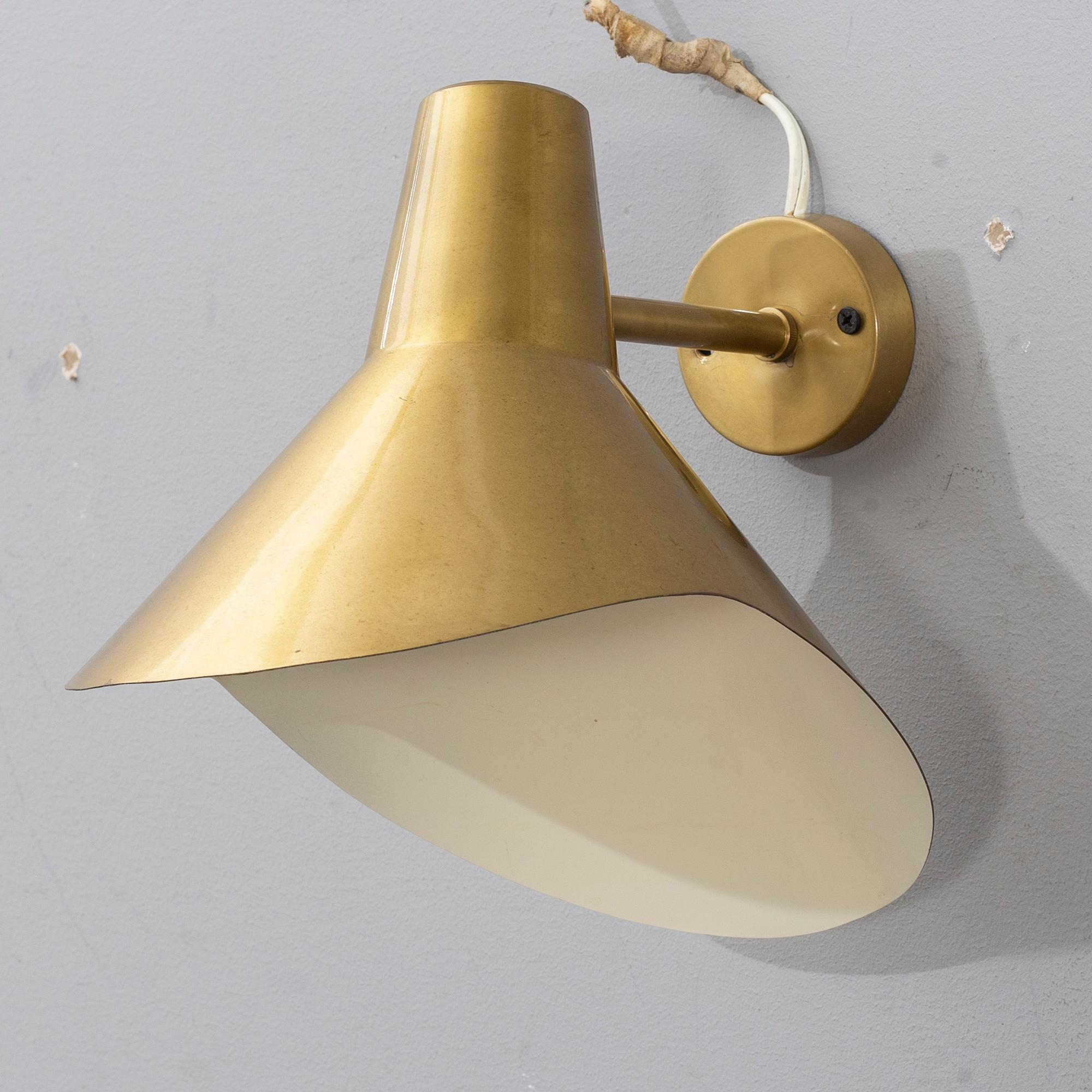 HANS BERGSTRÖM, a 'V319' brass wall lamps, from Ateljé Lyktan, designed 1947.