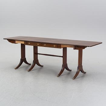A mahogany dining table with folding and additional leaves, Nordiska Kompaniet, designed 1945.