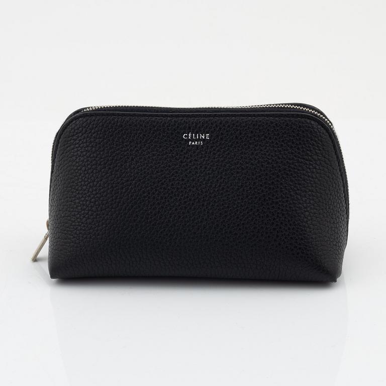 Céline, A small cosmetic pouch in black leather.