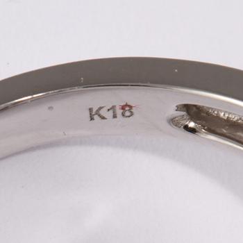RING, 18k vitguld med 49 briljantslipade diamanter, tot 0.59 ct samt 54 blå safirer, tot 1.21 ct. Vikt 6 g.