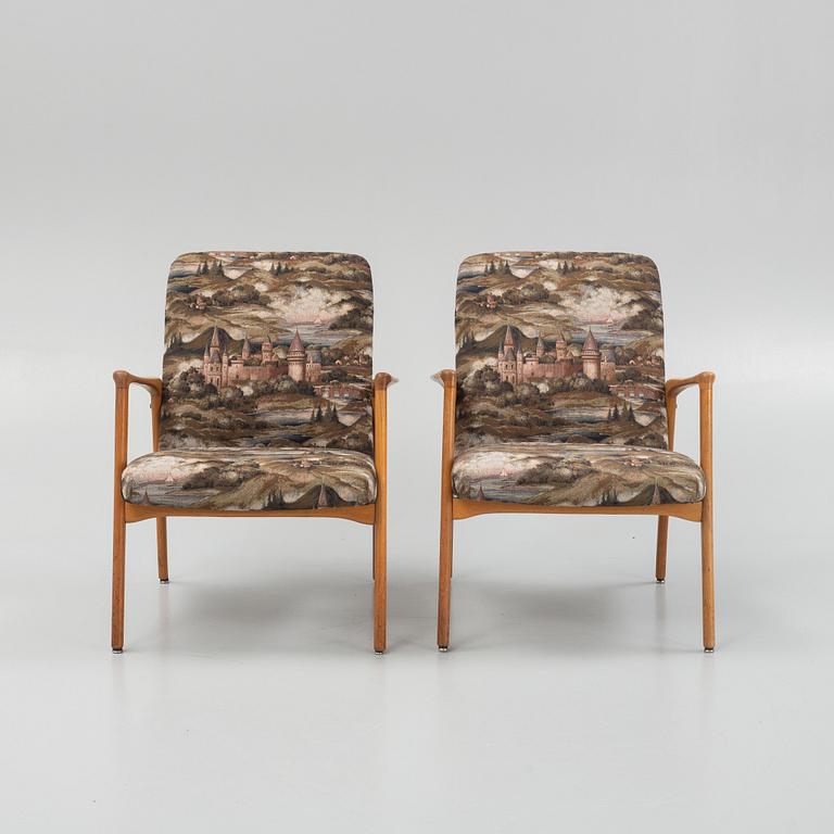 A pair of mid 20th century armchairs.