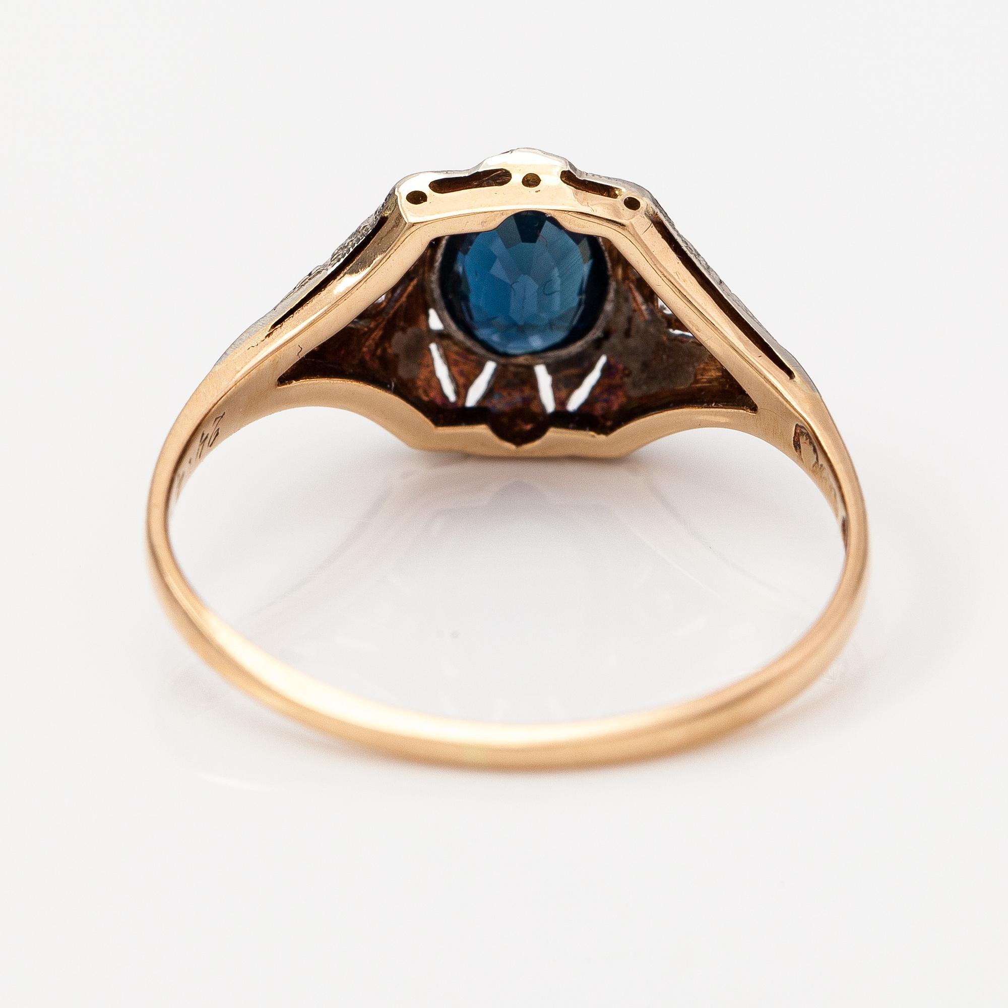 A 14K gold ring with diamonds ca. 0.02 ct in total and a sapphire. Finnish import marks.