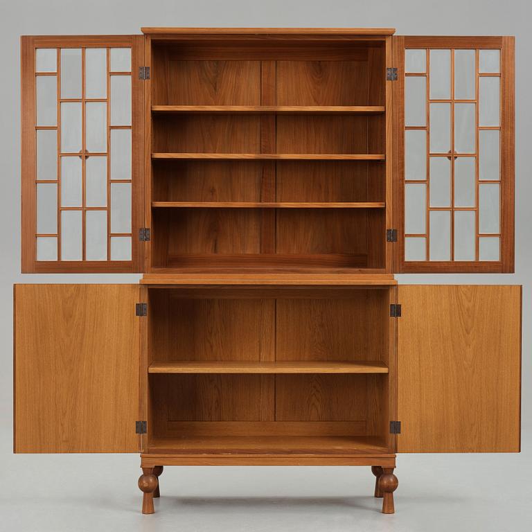 A Swedish Grace mahogany showcase cabinet, reportedly a win at the Stockholm Cabinetmaker's association lottery, 1920's.