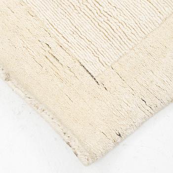 A hantd tufted carpet, 'Entrance - bone white' by Layered, ca 400 x 300 cm.