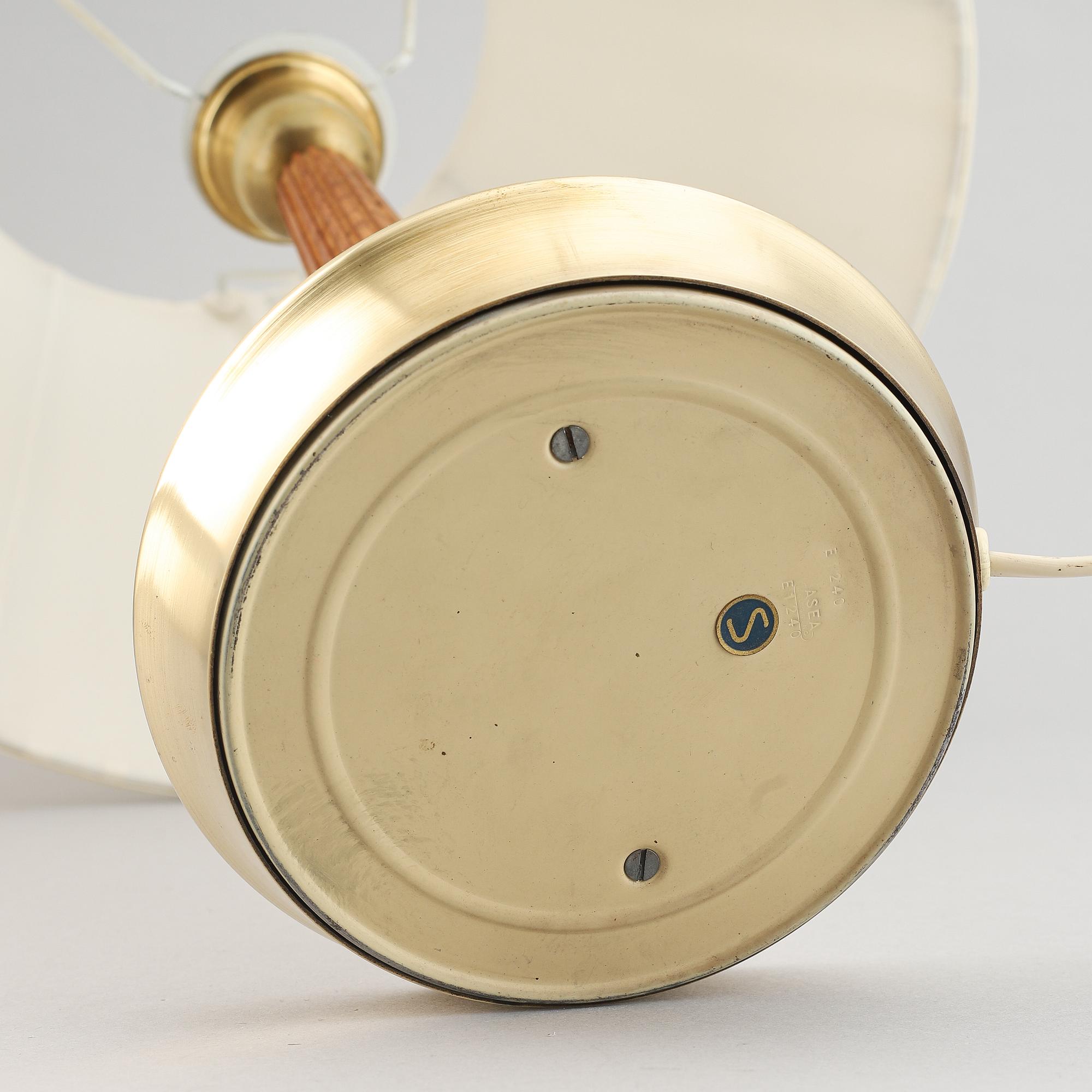 A brass and oak table light by Hans Bergström for ASEA, mid 20th Century.