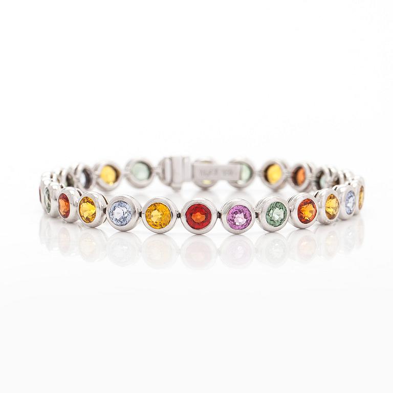An 18K white gold bracelet, set with multicoloured sapphires.