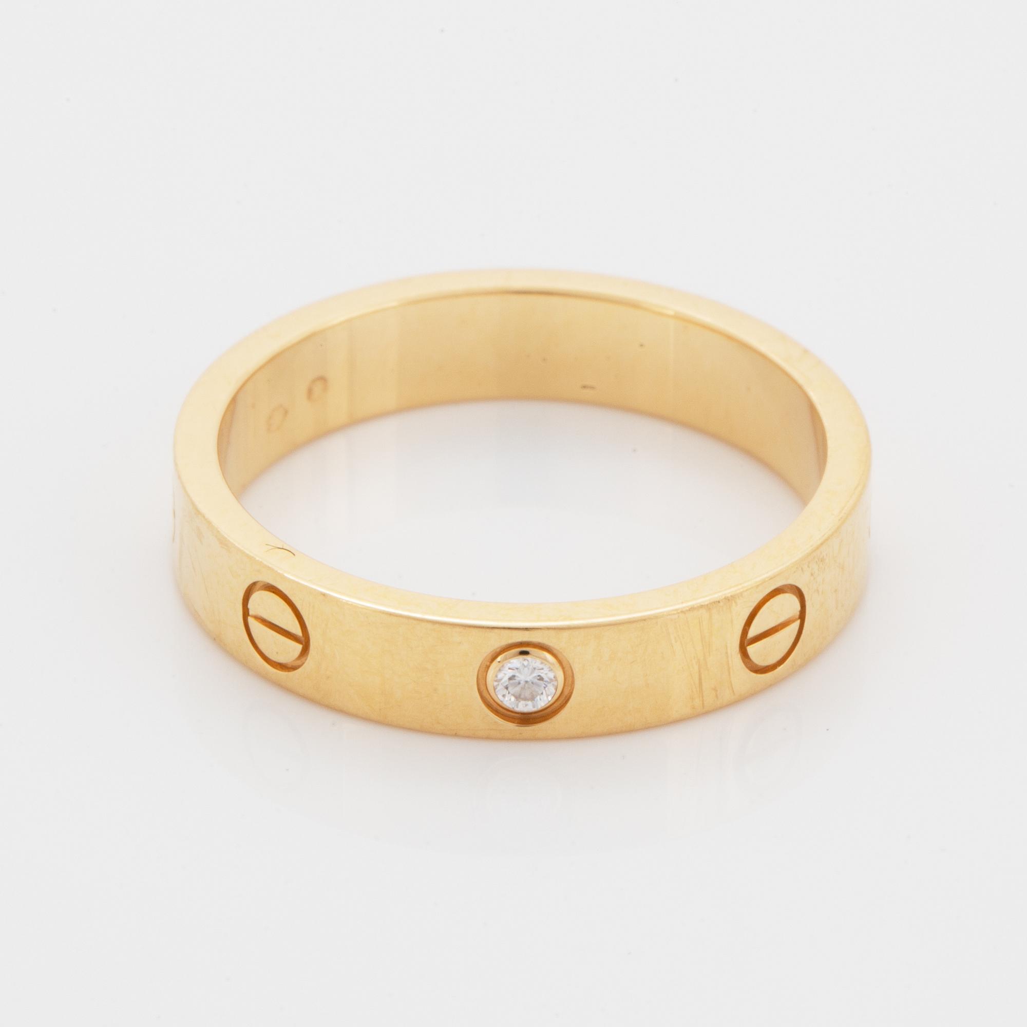 Cartier ring "Love" 18K guld med en rund briljantslipad diamant.